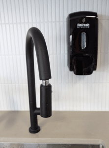 black soap dispenser on wall black soap dispenser on wall