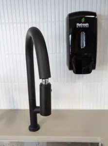 black soap dispenser on wall black soap dispenser on wall